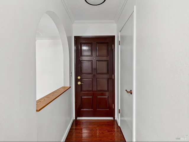 a bedroom with a bed and a potted plant