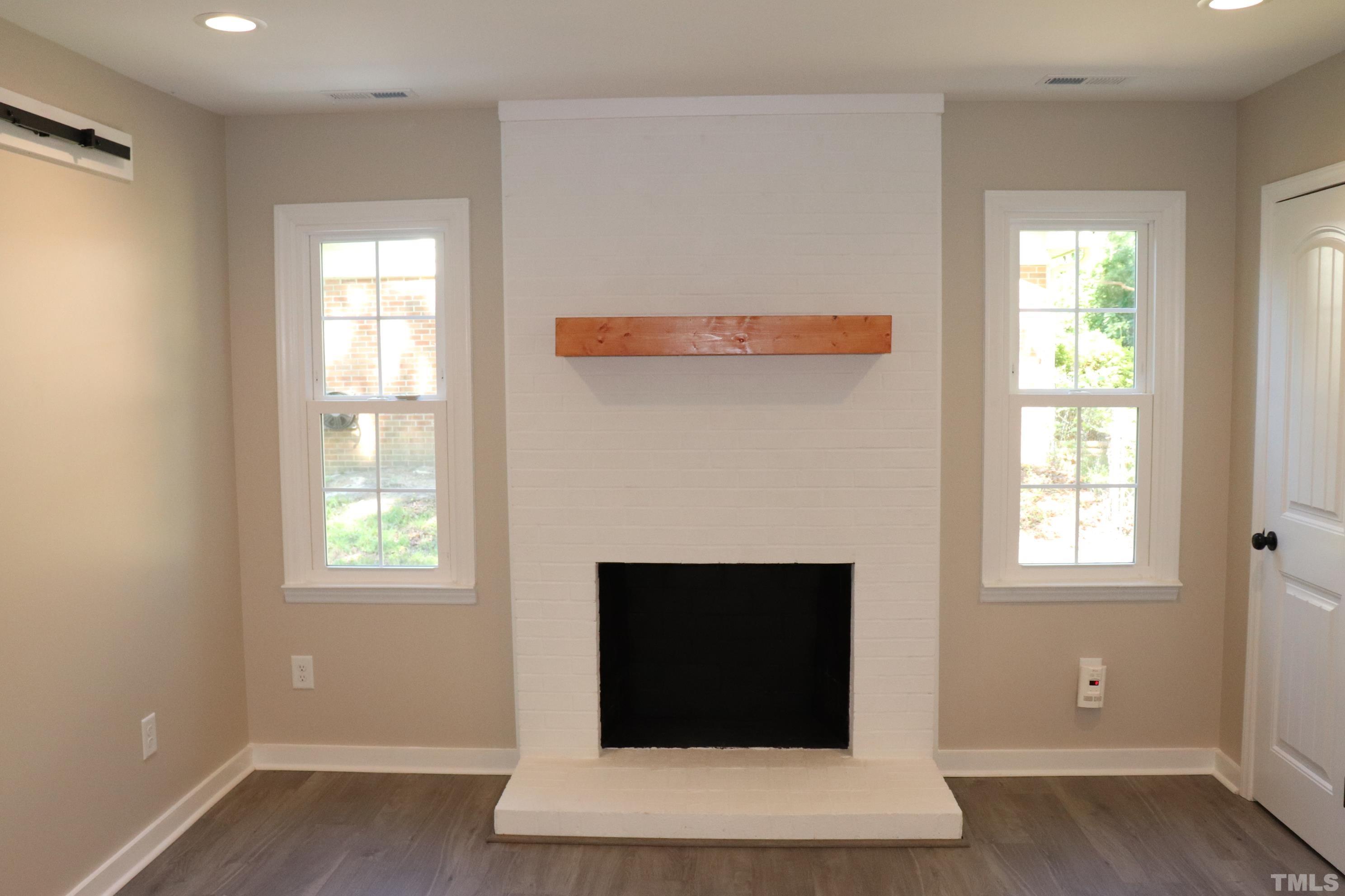 1108 Wyldewood Road Durham, NC 27704 - Photo 17 of 35 an entryway with fireplace and window
