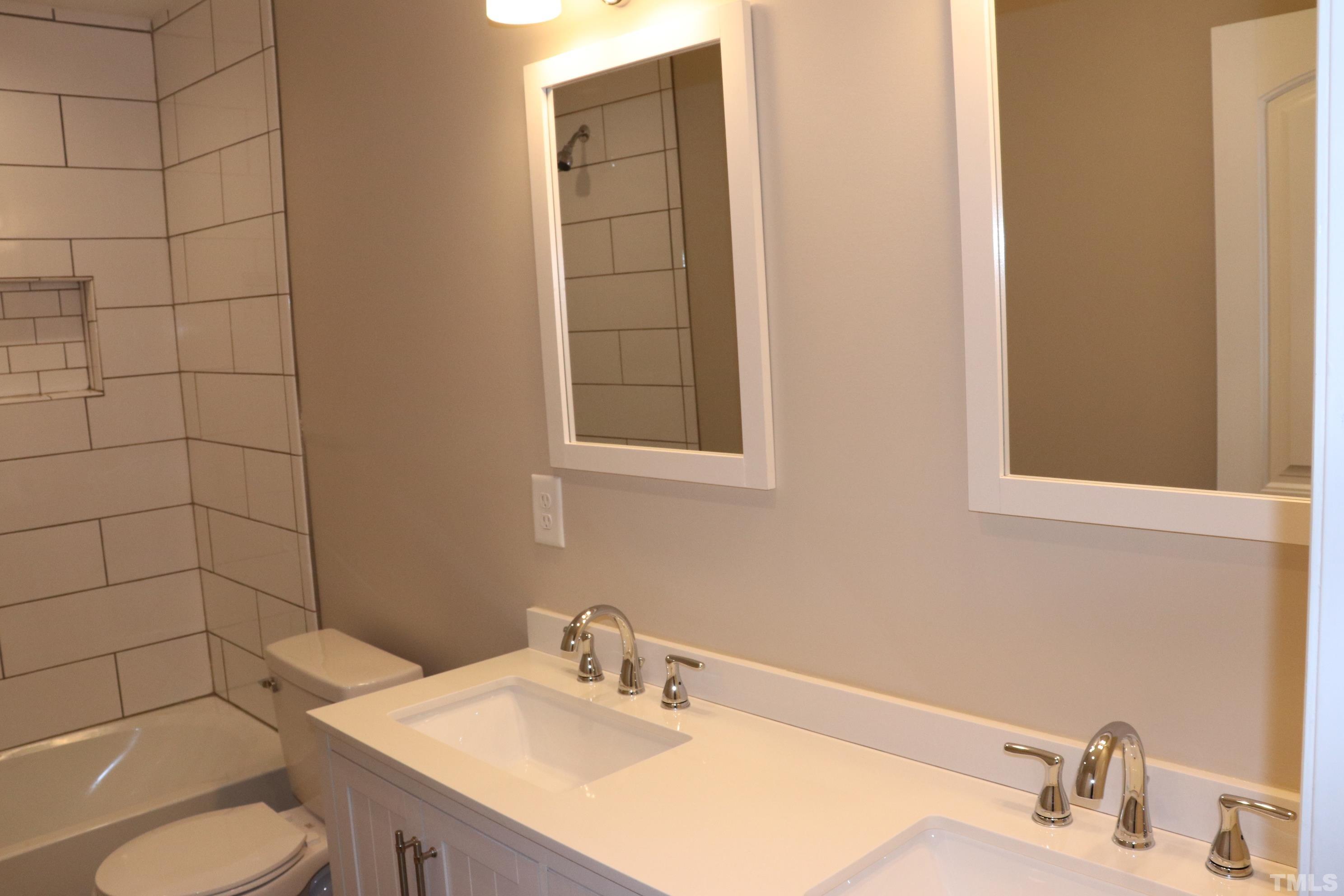 1108 Wyldewood Road Durham, NC 27704 - Photo 20 of 35 a bathroom with a sink toilet and mirror
