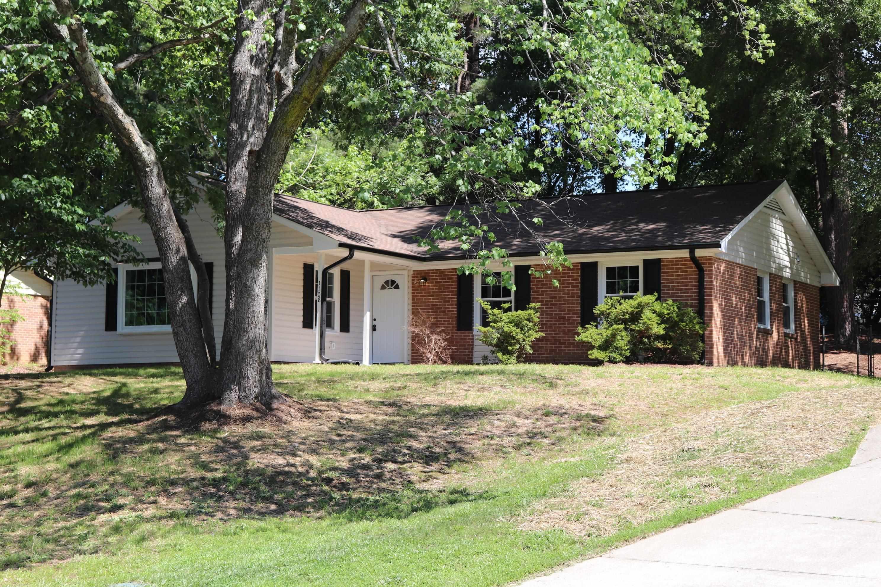 1108 Wyldewood Road Durham, NC 27704 - Photo 2 of 35 a front view of a house with a yard