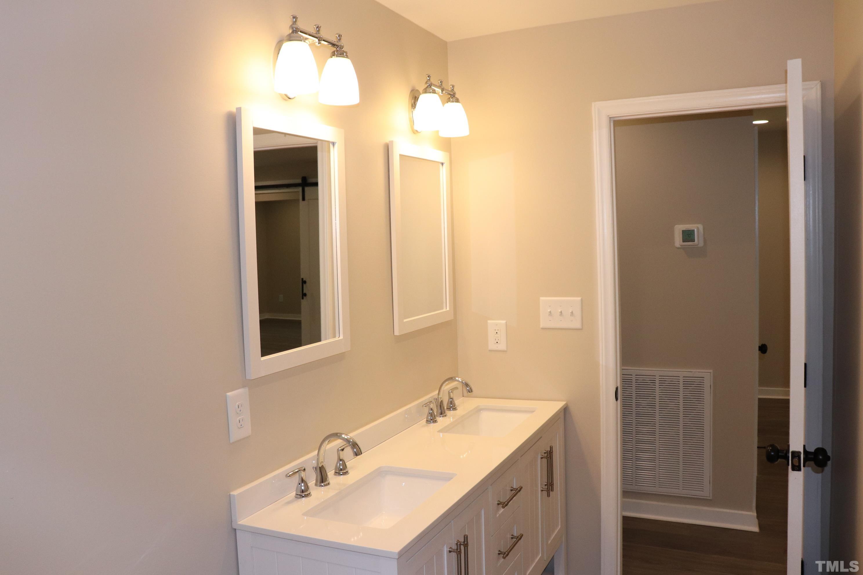 1108 Wyldewood Road Durham, NC 27704 - Photo 29 of 35 a bathroom with a sink and a mirror