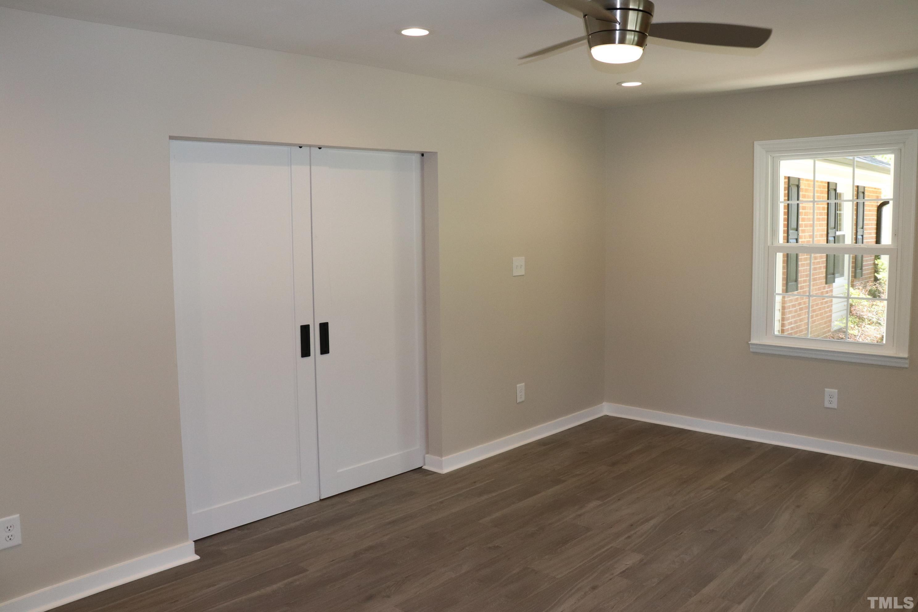 1108 Wyldewood Road Durham, NC 27704 - Photo 33 of 35 wooden floor in an empty room with a window