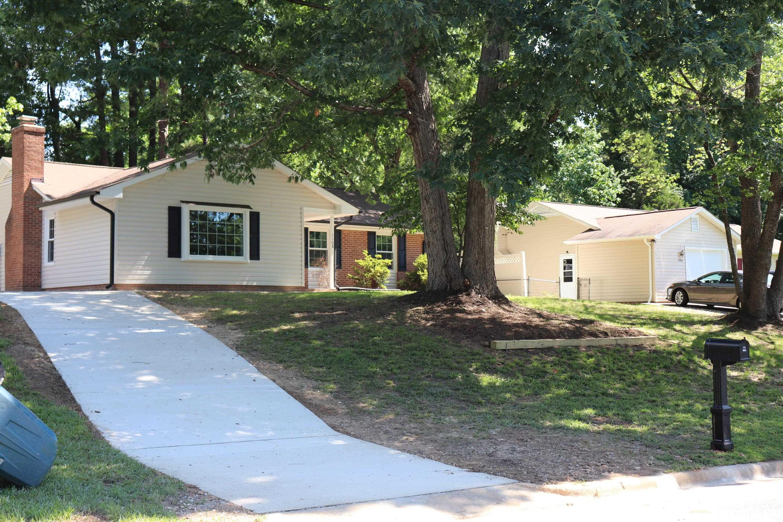 1108 Wyldewood Road Durham, NC 27704 - Photo 4 of 35 a house view with a backyard space