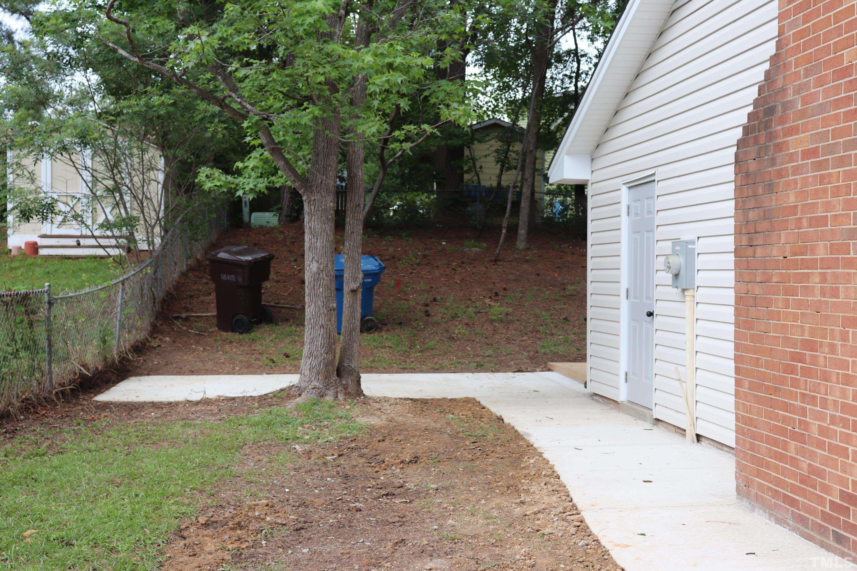 1108 Wyldewood Road Durham, NC 27704 - Photo 6 of 35 a view of a back yard of the house