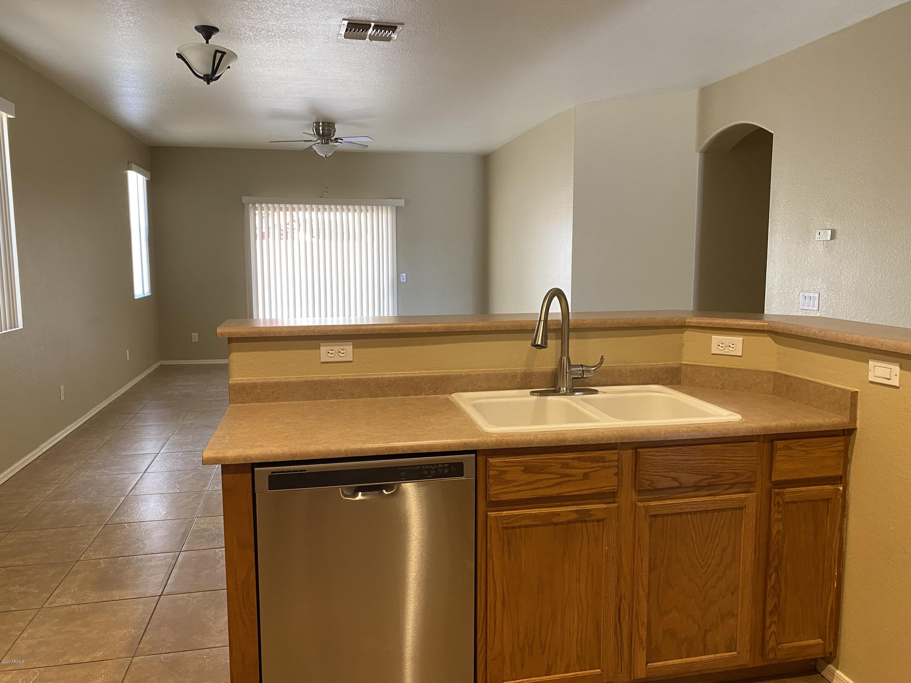 4361 South Splendor Place Gilbert, AZ 85297 - Photo 7 of 14 a bathroom with a sink and a mirror