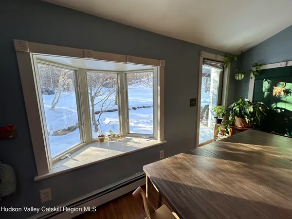 a view of a room with a large window