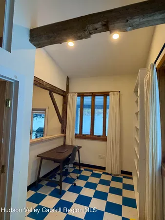 a room with window and wooden floor