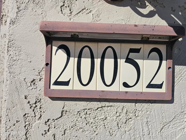 a black and white door with a sign