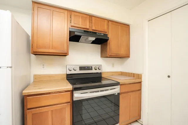 a kitchen with a stove and a microwave