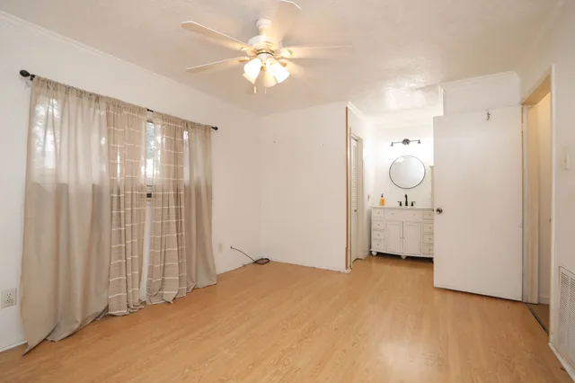 a view of a bathroom with a sink and a mirror