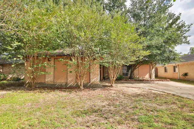 a house with trees in front of it