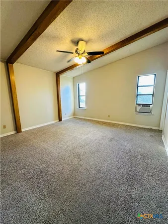 a view of a big room with windows
