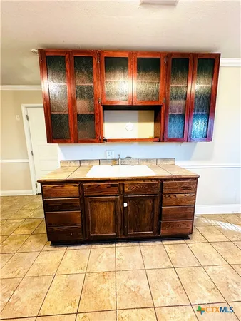 a bathroom with a sink and a large mirror