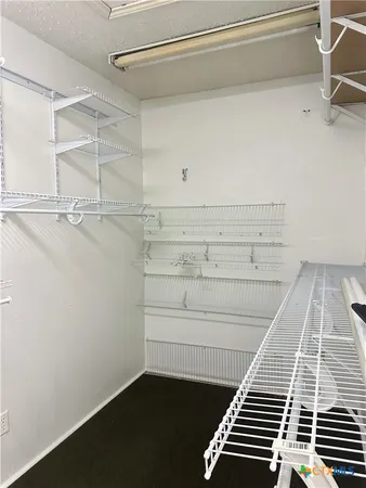 a view of a room with racks on the wall