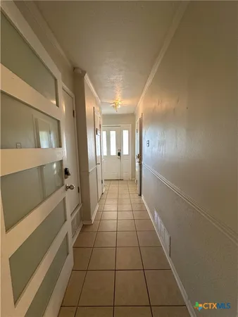 a view of an empty room and window