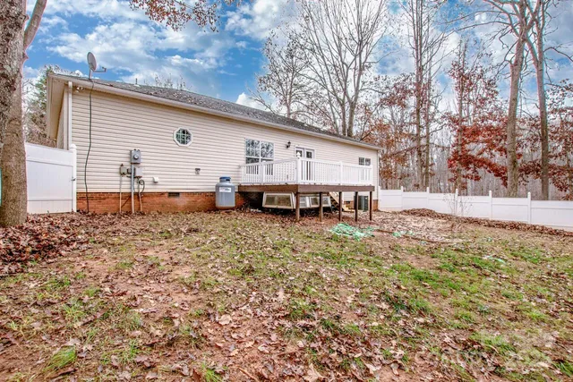 a backyard of a house with yard and outdoor seating