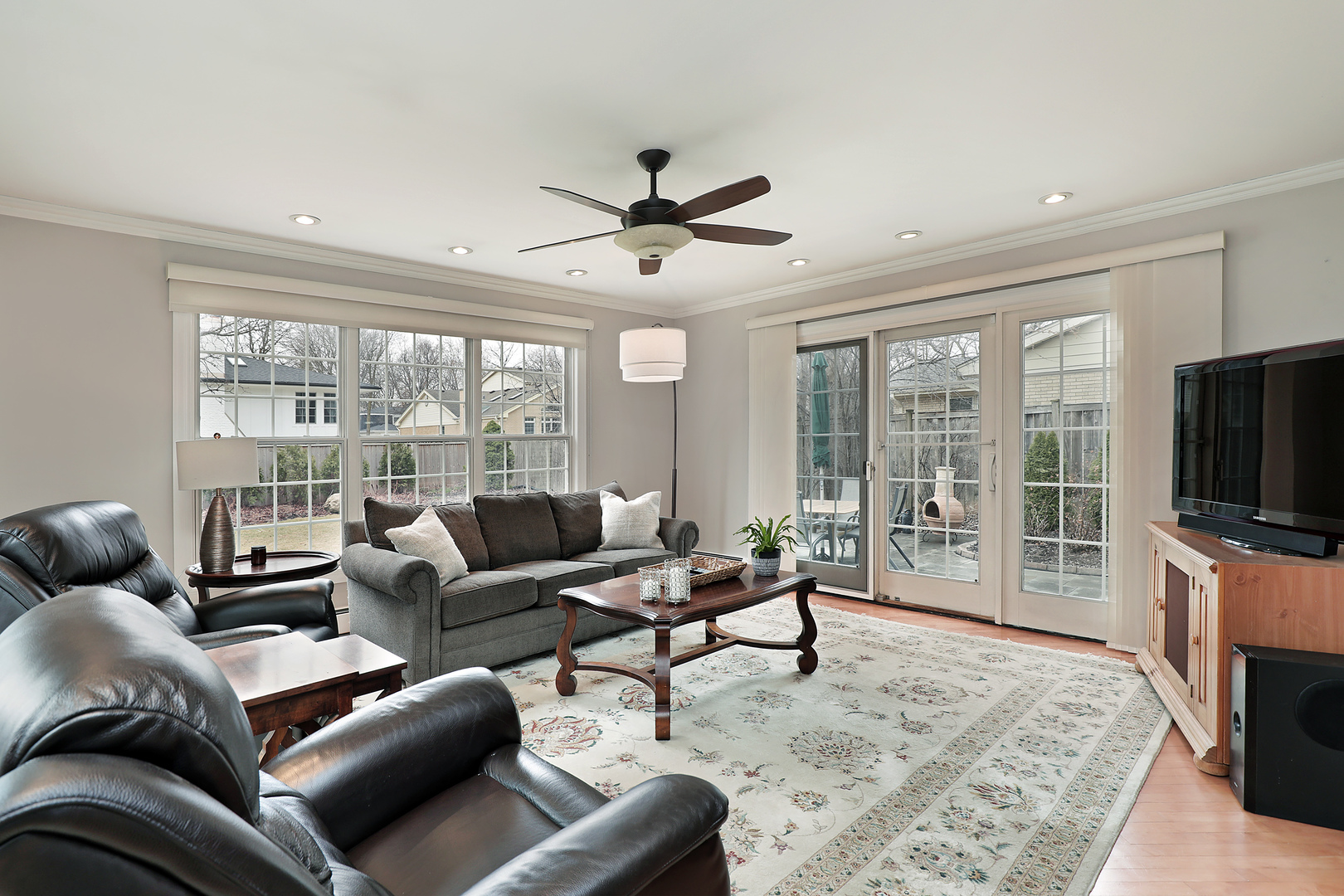 2915 Shannon Road Northbrook, IL 60062 - Photo 13 of 33 a living room with furniture a flat screen tv and a large window