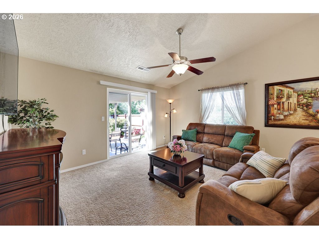 87836 8th Street Veneta, OR 97487 - Photo 2 of 25 a living room with furniture a chandelier and a window