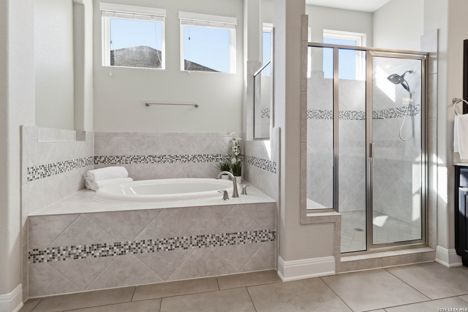 3337 Harvest View Marion, TX 78124 - Photo 17 of 39 a spacious bathroom with a tub shower and mirror