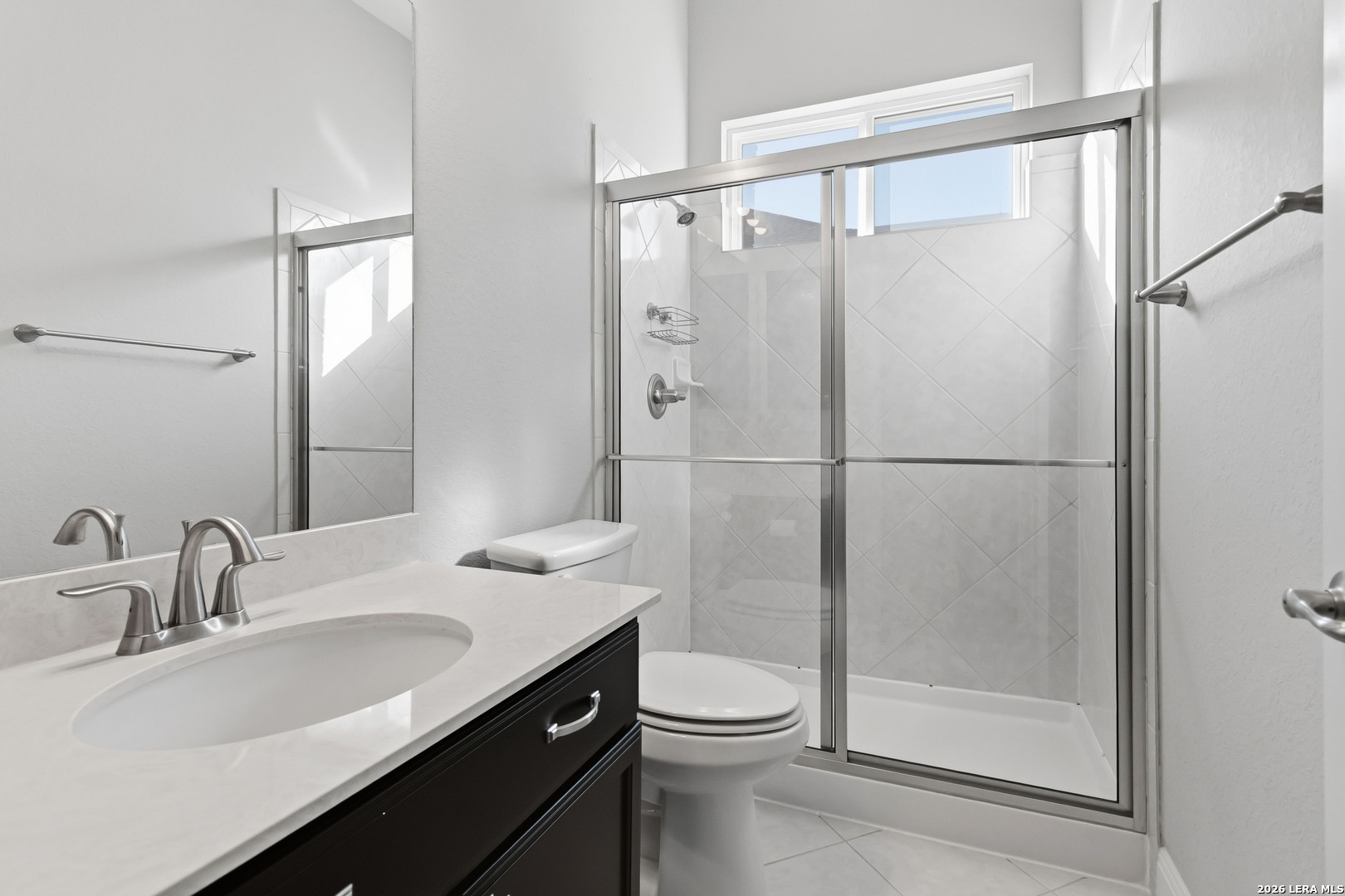 3337 Harvest View Marion, TX 78124 - Photo 23 of 39 a bathroom with a shower sink vanity mirror and toilet
