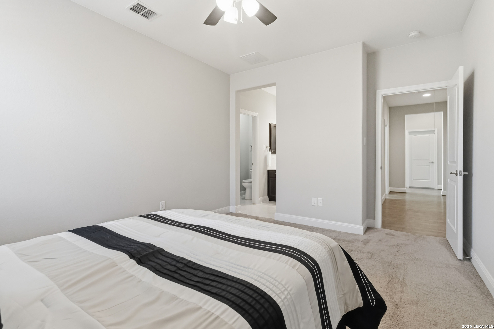 3337 Harvest View Marion, TX 78124 - Photo 25 of 39 a bedroom with a bed and a chandelier