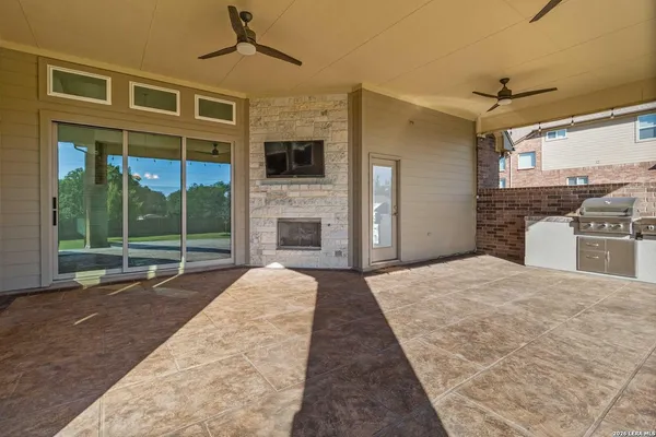 a kitchen with stainless steel appliances granite countertop a stove and refrigerator
