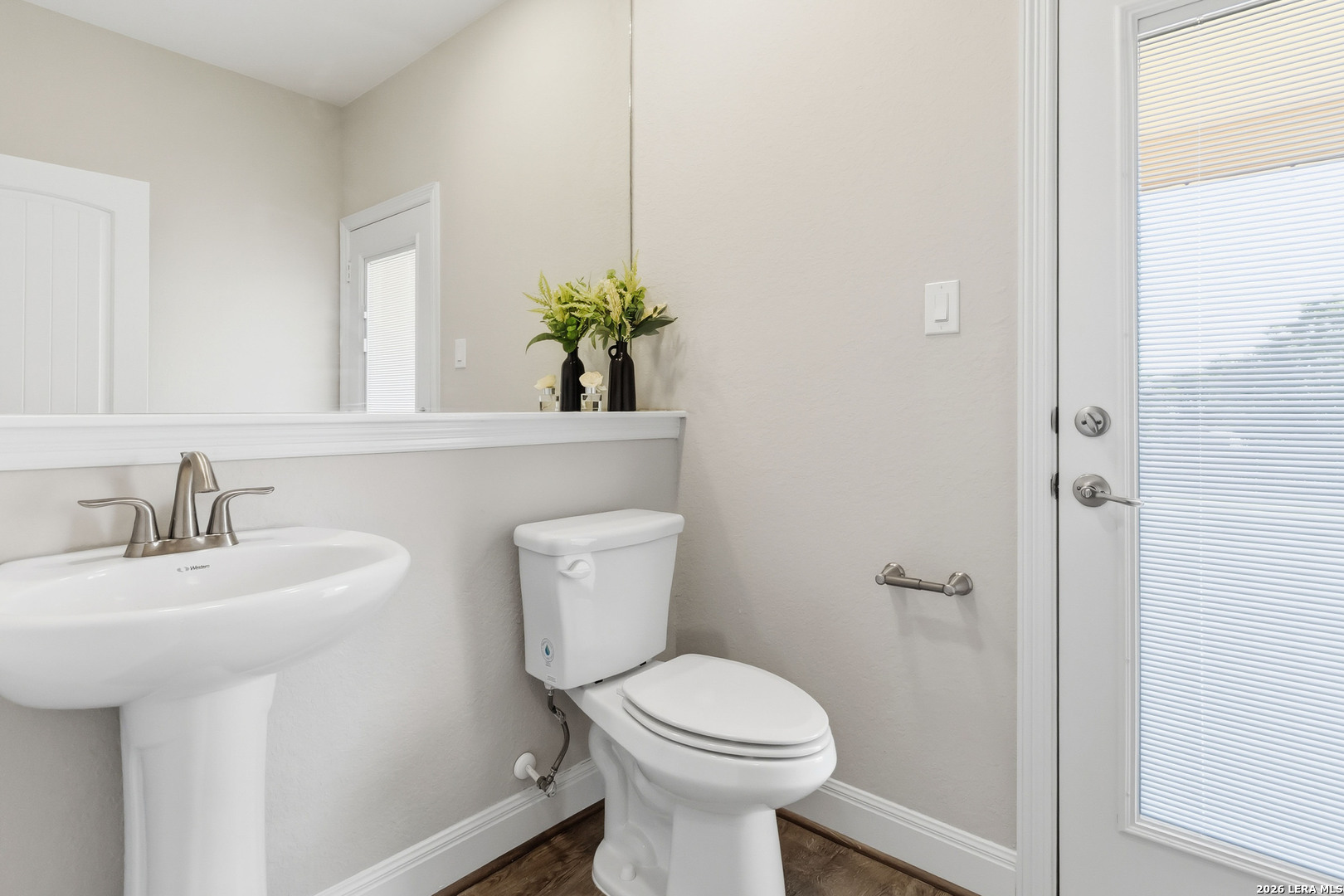 3337 Harvest View Marion, TX 78124 - Photo 31 of 39 a bathroom with a toilet sink and mirror