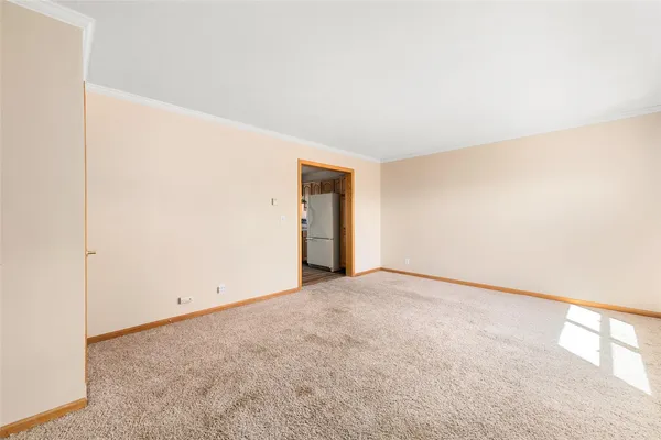 a view of an empty room and window