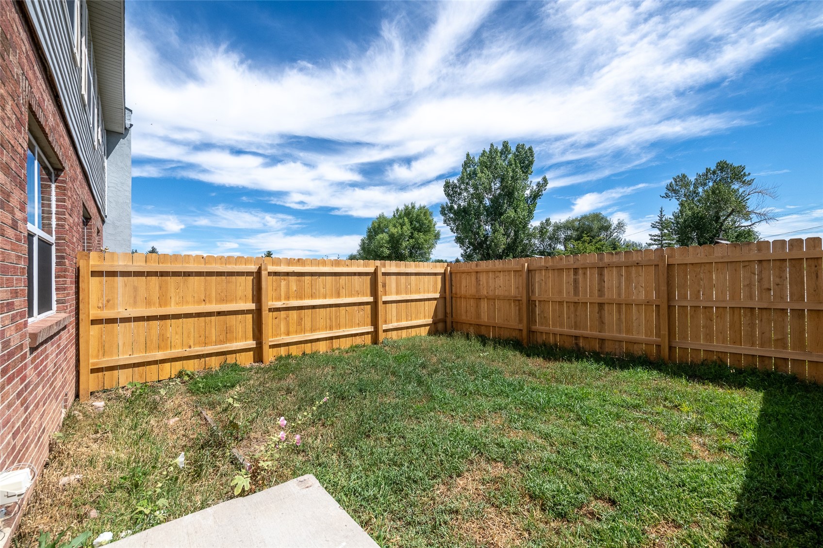 409 South 3rd Street, Unit 409 Hayden, CO 81639 - Photo 4 of 23 a view of backyard with wooden fence