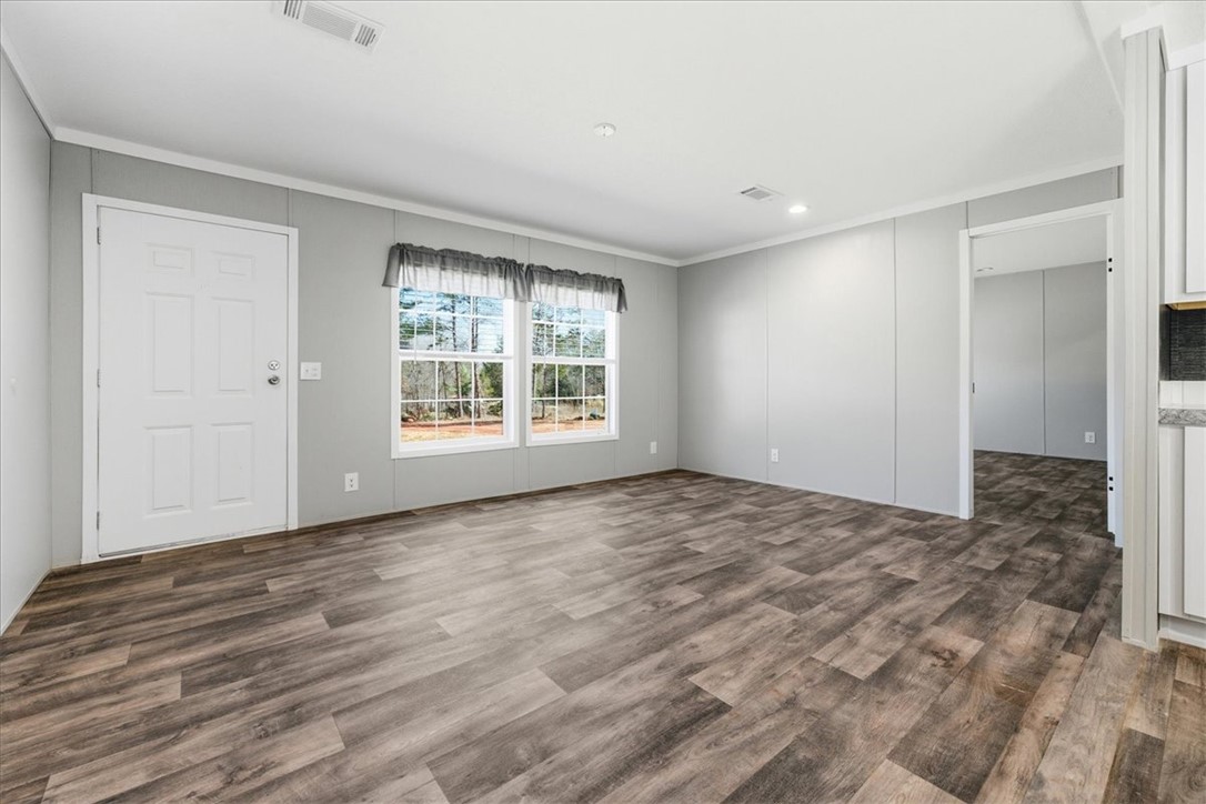 205 Union Court West Union, SC 29696 - Photo 5 of 28 This living area features a clean design with durable flooring and ample natural light.