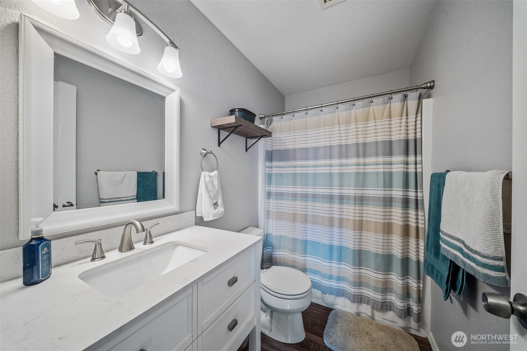 5513 Park Pl Loop Southeast Lacey, WA 98503 - Photo 15 of 33 a bathroom with a sink toilet and shower