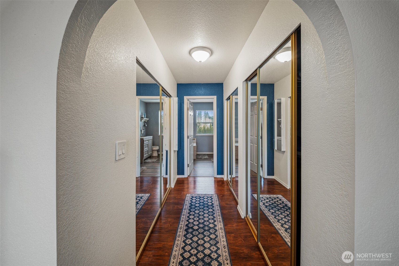 5513 Park Pl Loop Southeast Lacey, WA 98503 - Photo 19 of 33 a view of a hallway with wooden floor