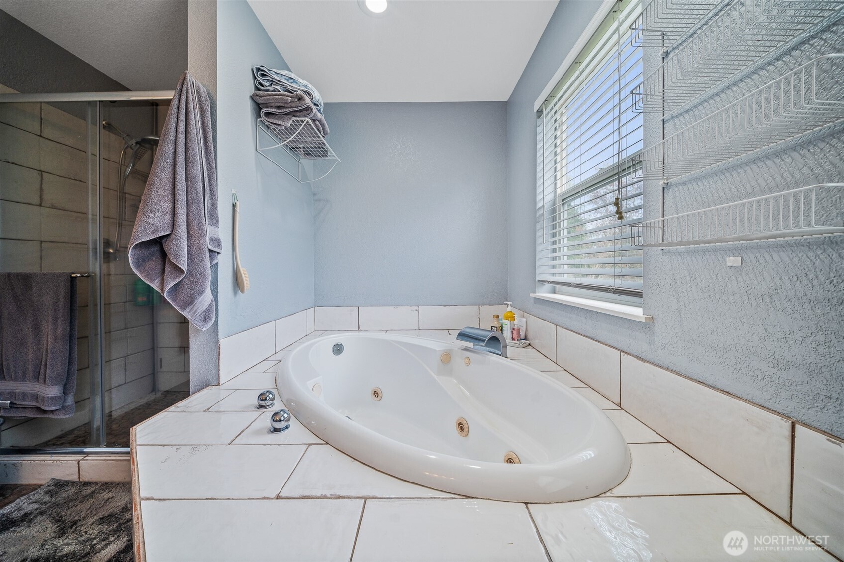 5513 Park Pl Loop Southeast Lacey, WA 98503 - Photo 20 of 33 a bathroom with a bathtub and shower