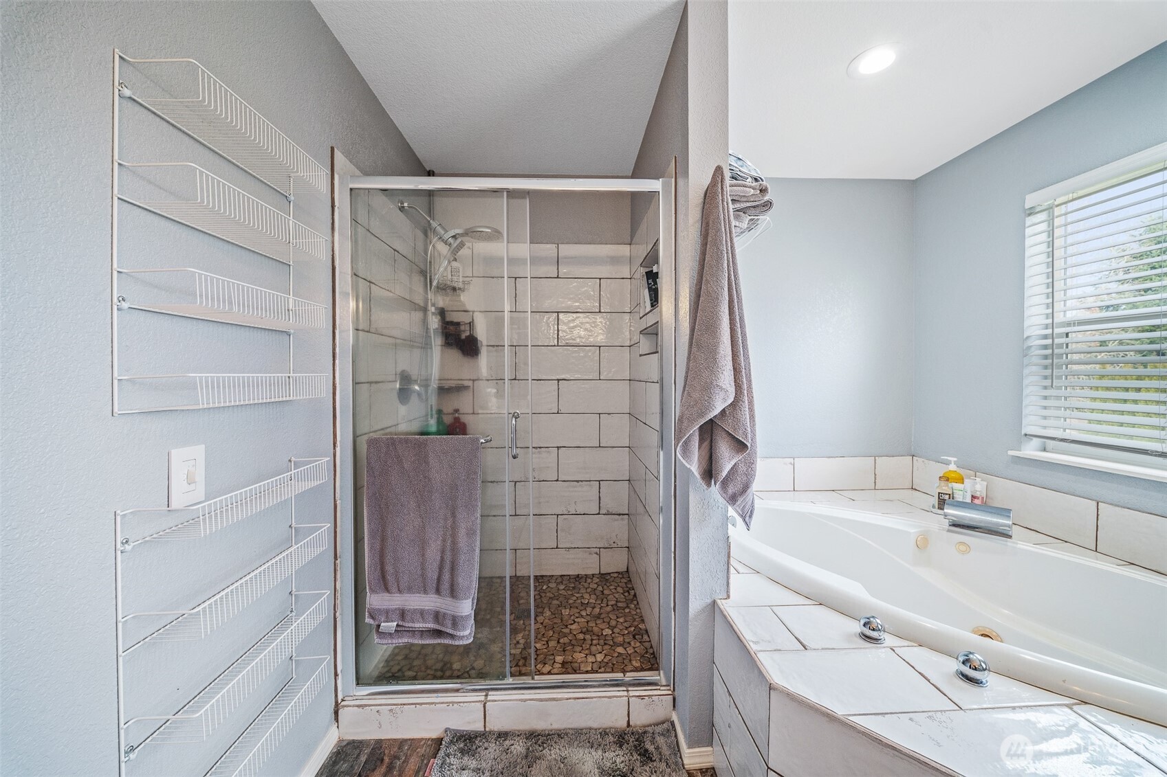5513 Park Pl Loop Southeast Lacey, WA 98503 - Photo 21 of 33 a bathroom with a bathtub and a shower