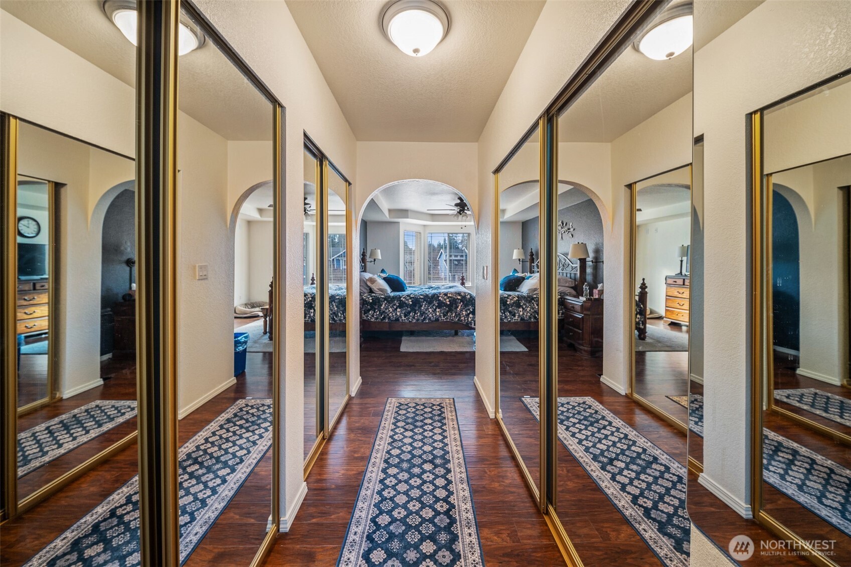 5513 Park Pl Loop Southeast Lacey, WA 98503 - Photo 23 of 33 a view of a hallway with wooden floor and furniture