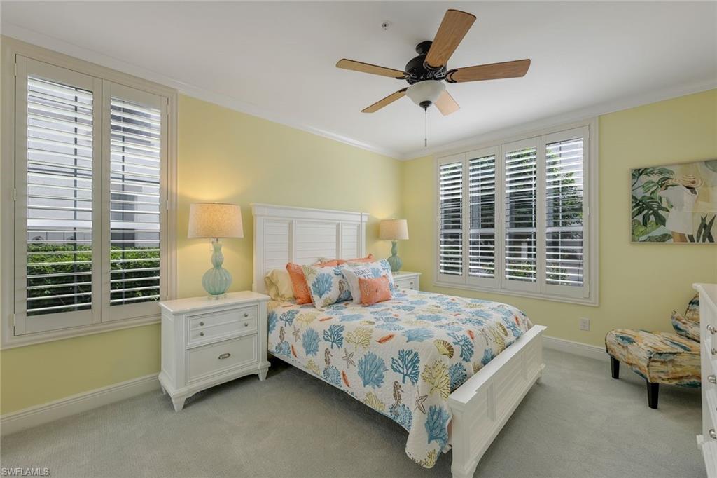 269 Colonade Circle, Unit 2802 Naples, FL 34103 - Photo 30 of 50 a bedroom with a bed and a window