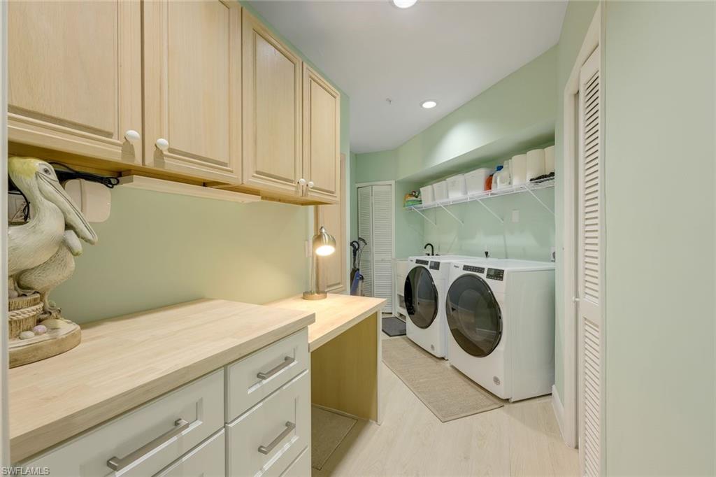 269 Colonade Circle, Unit 2802 Naples, FL 34103 - Photo 35 of 50 a utility room with dryer and washer