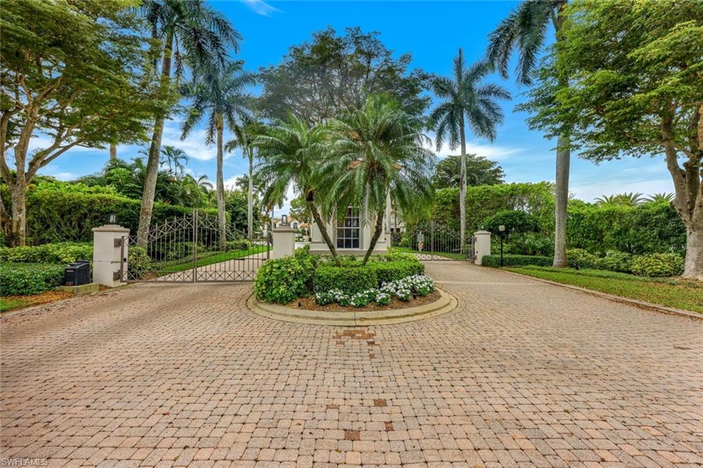 269 Colonade Circle, Unit 2802 Naples, FL 34103 - Photo 38 of 50 a view of a backyard with palm trees