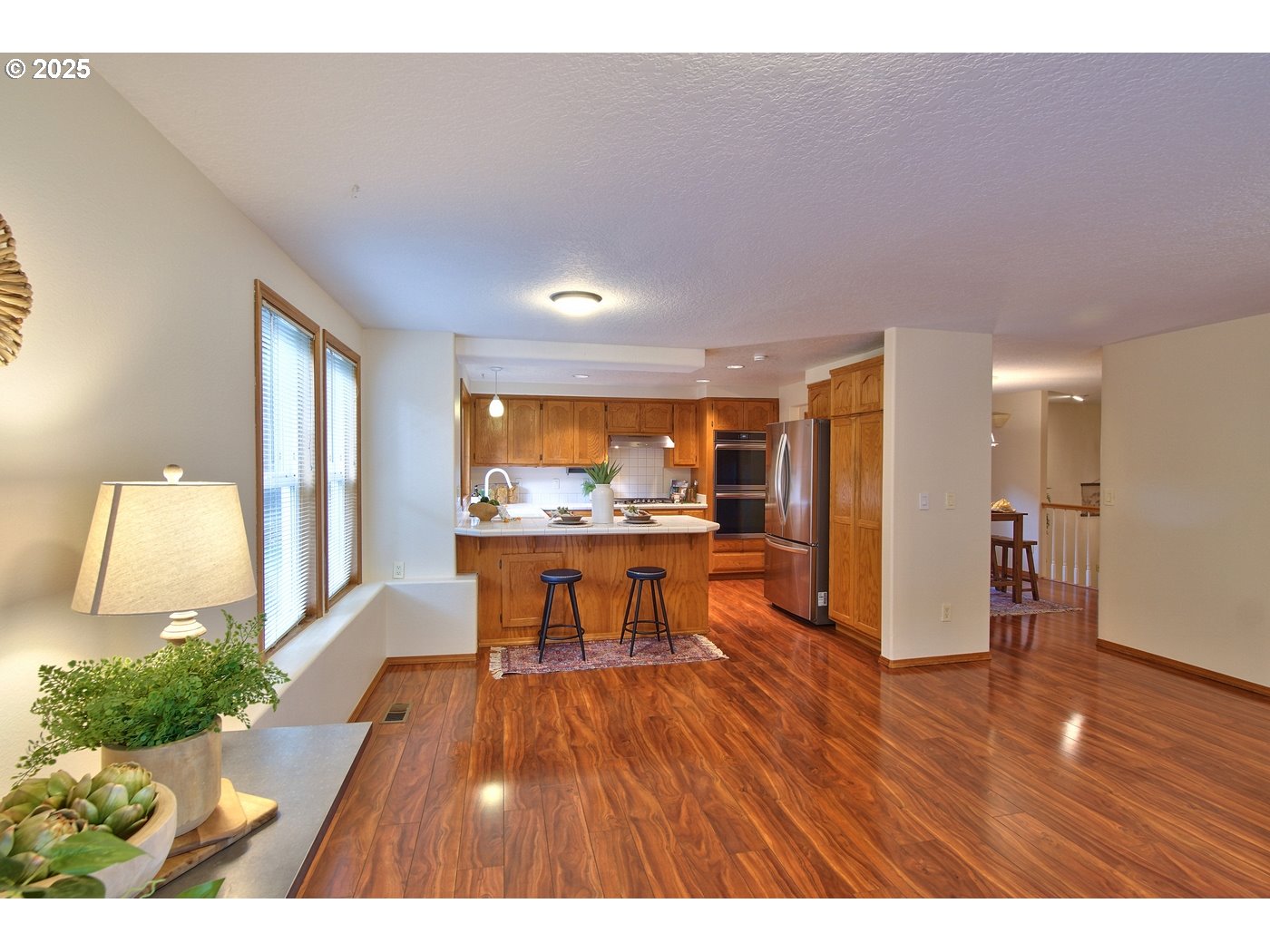 8411 Southwest 184th Loop Beaverton, OR 97007 - Photo 13 of 34 a view of a living room and dining room