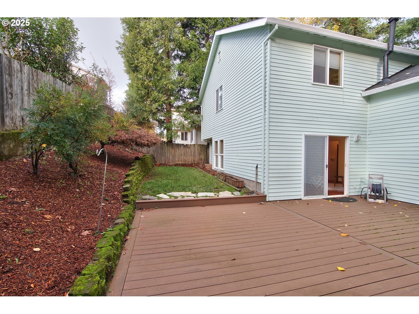 8411 Southwest 184th Loop Beaverton, OR 97007 - Photo 15 of 34 a view of a backyard with a patio