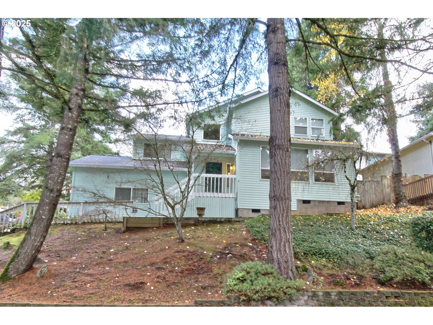 8411 Southwest 184th Loop Beaverton, OR 97007 - Photo 2 of 34 a view of house in the forest