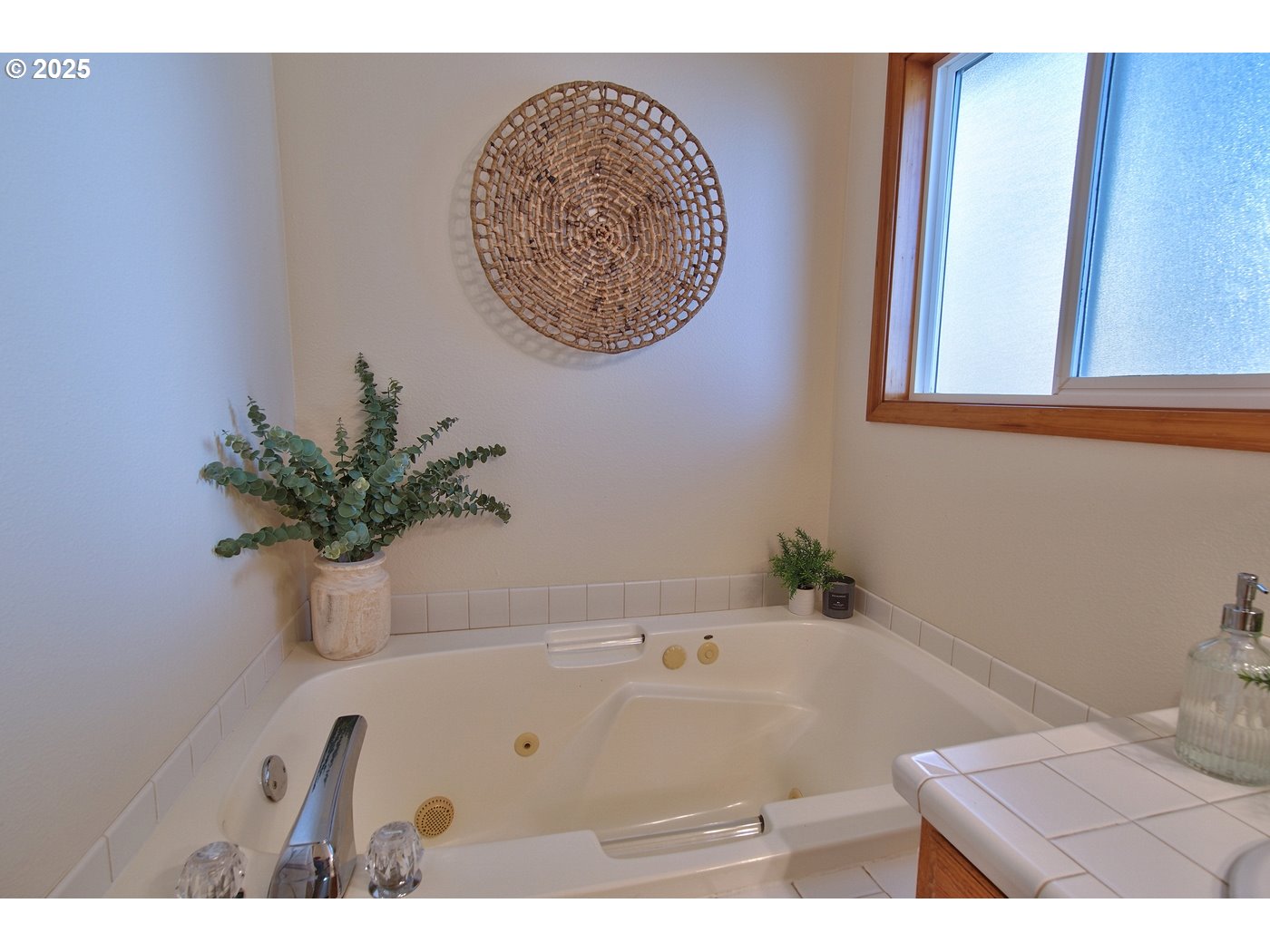 8411 Southwest 184th Loop Beaverton, OR 97007 - Photo 21 of 34 a bath tub sitting in a bathroom next to a sink
