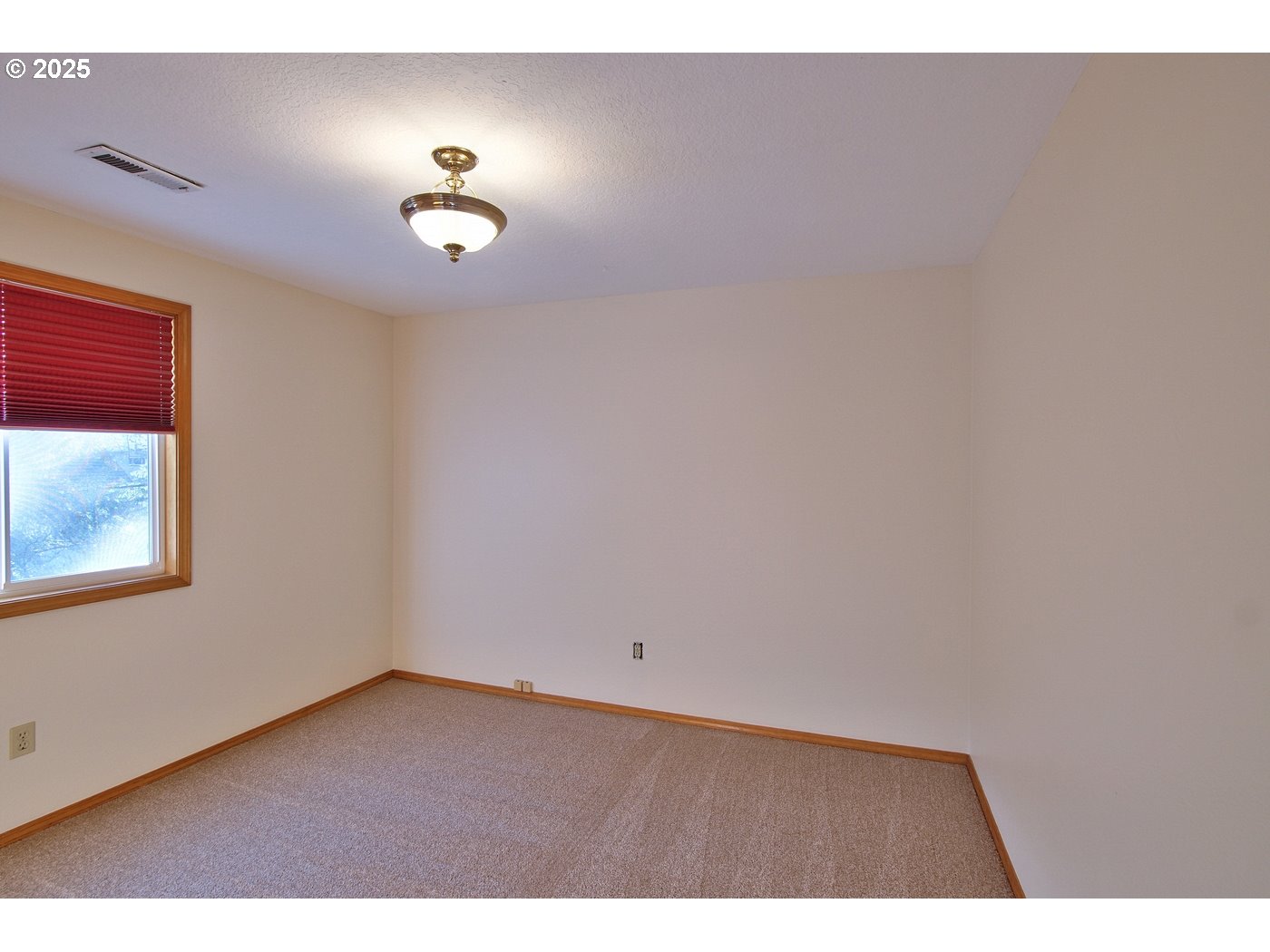 8411 Southwest 184th Loop Beaverton, OR 97007 - Photo 25 of 34 a view of an empty room with a window