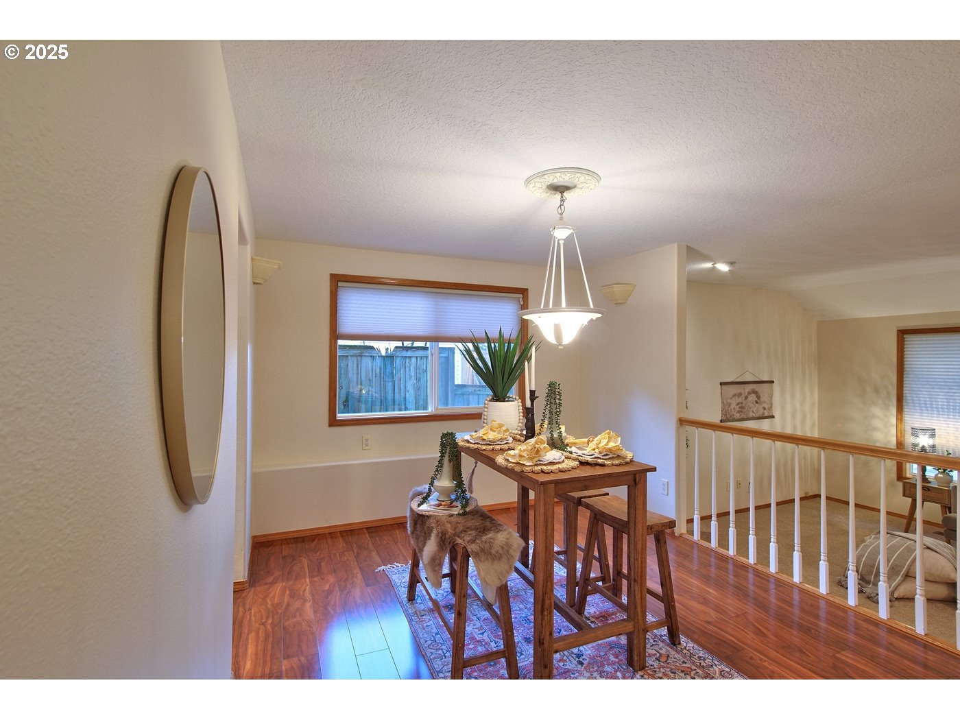 8411 Southwest 184th Loop Beaverton, OR 97007 - Photo 7 of 34 a view of a dining room with furniture and wooden floor