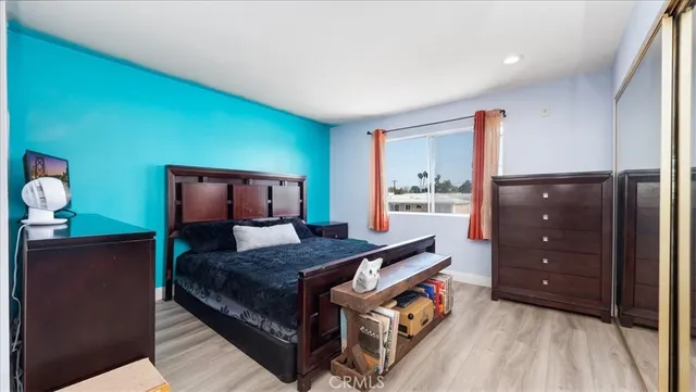 a bed room with a bed and a dresser