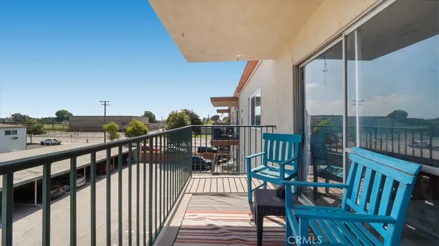 a view of a balcony with wooden floor