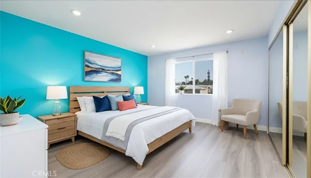 a bedroom with a bed and a couch