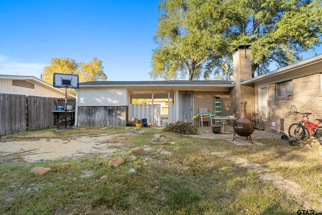 a view of backyard with green space