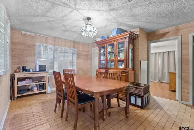 a kitchen with a sink appliances and cabinets