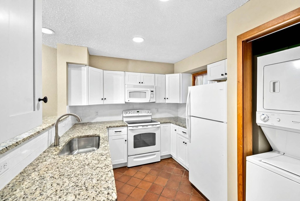 805-119 Highway 534 Loop Kerrville, TX 78028 - Photo 11 of 23 a kitchen with a refrigerator sink stove and cabinets